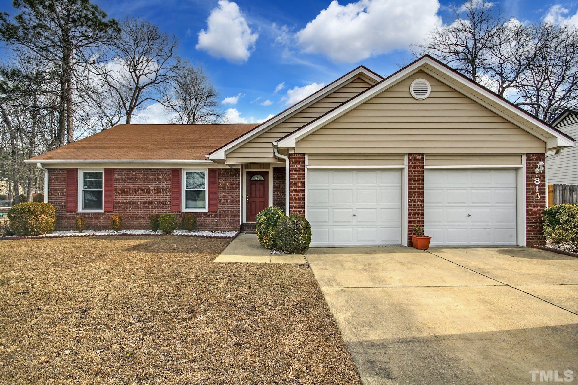 813 Rim Road Fayetteville, NC 28314 - Photo 1 of 25 a front view of a house with a yard