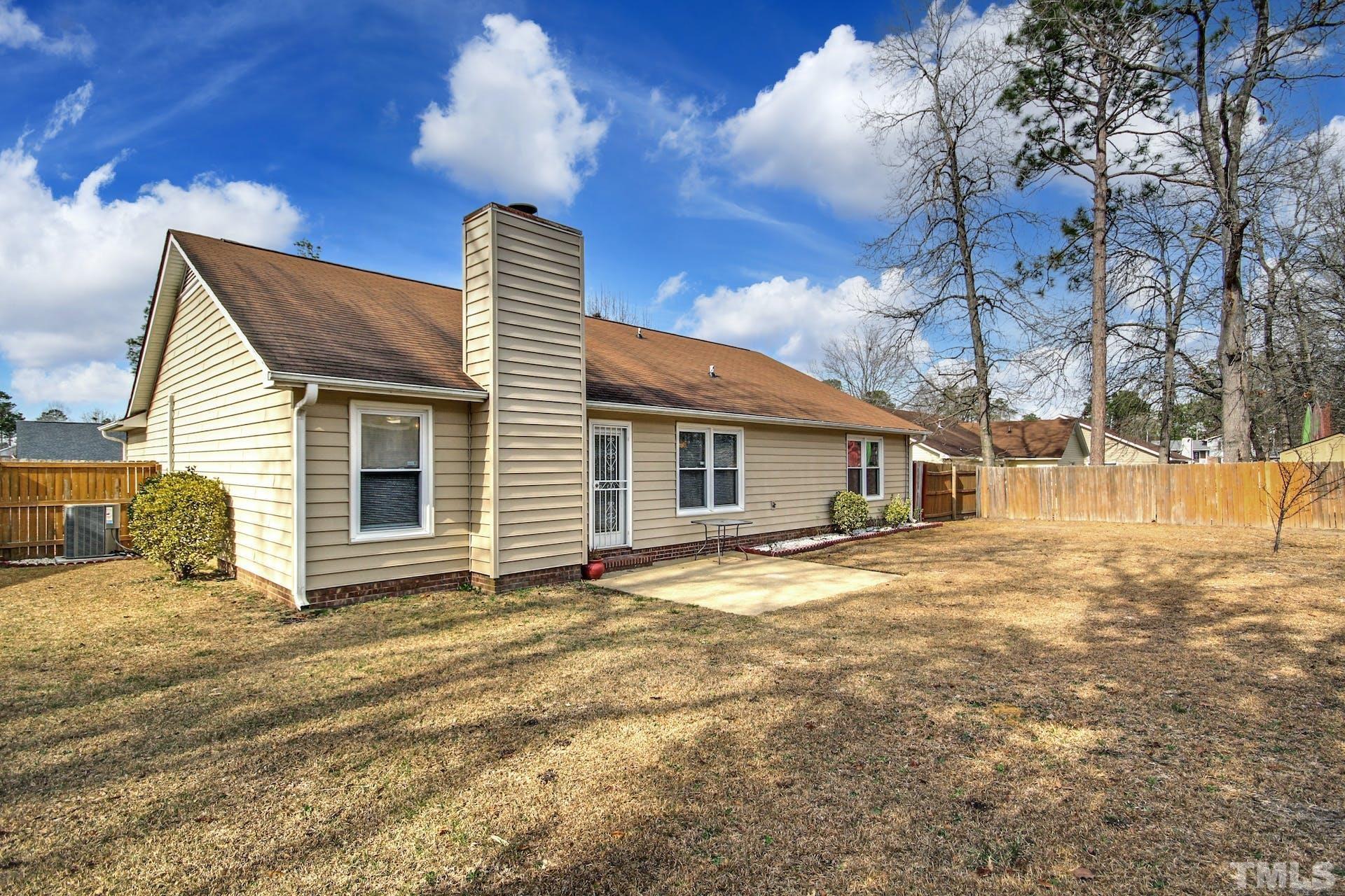 813 Rim Road Fayetteville, NC 28314 - Photo 20 of 25 a front view of a house with a yard
