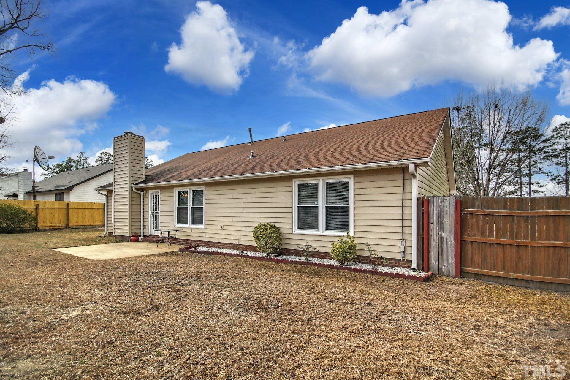 813 Rim Road Fayetteville, NC 28314 - Photo 22 of 25 a front view of a house with garden