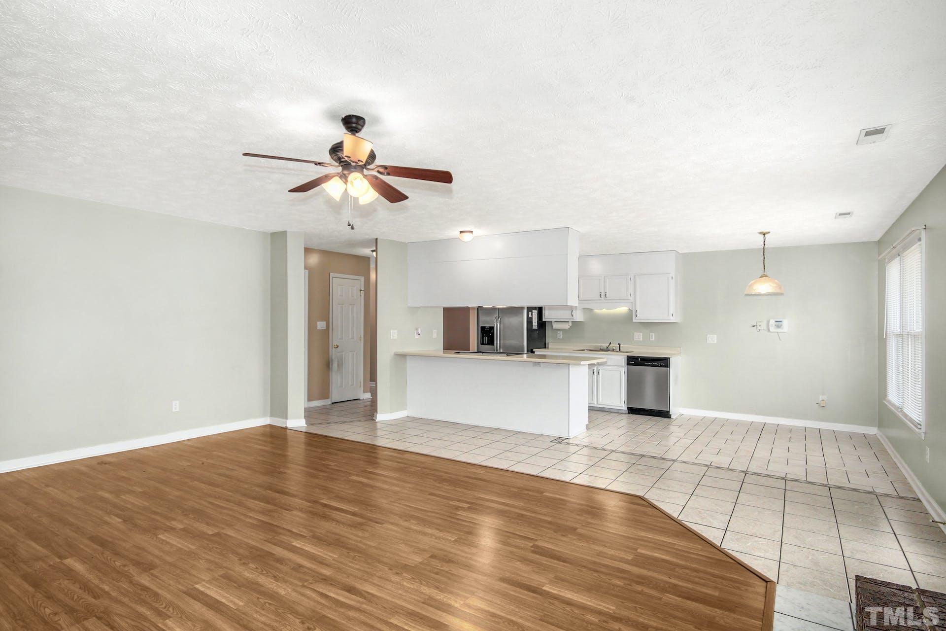 813 Rim Road Fayetteville, NC 28314 - Photo 5 of 25 a view of kitchen with granite countertop cabinets and refrigerator