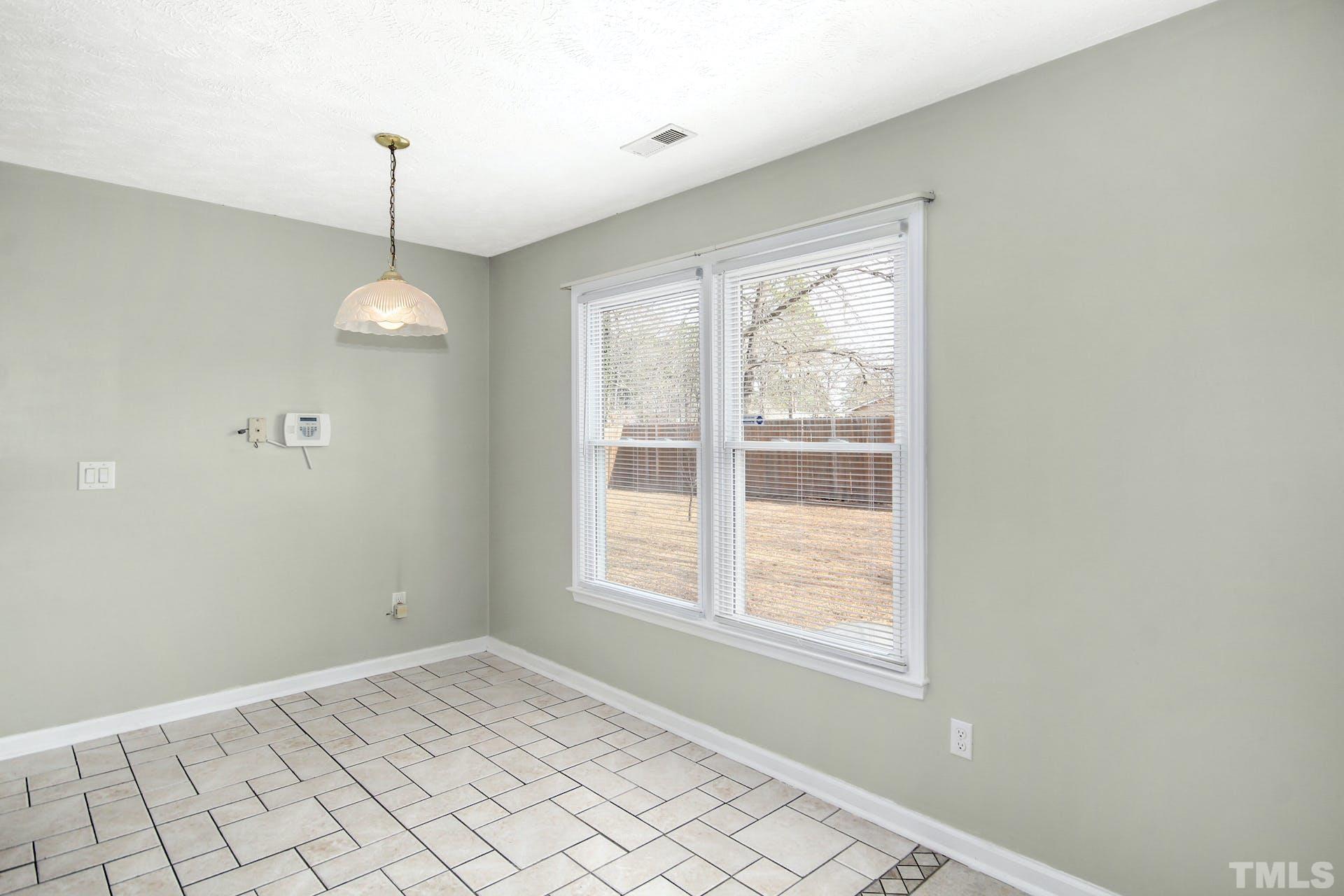 813 Rim Road Fayetteville, NC 28314 - Photo 7 of 25 a view of an empty room with window chandelier fan