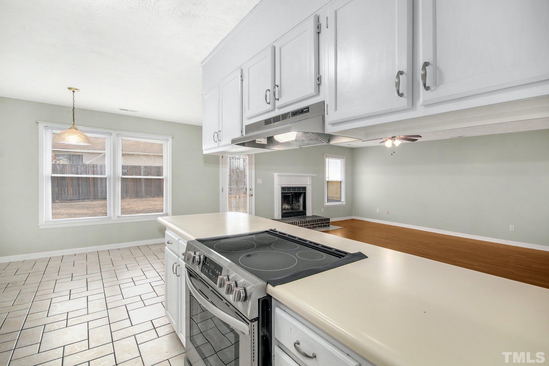 813 Rim Road Fayetteville, NC 28314 - Photo 10 of 25 a kitchen with granite countertop a stove and a sink