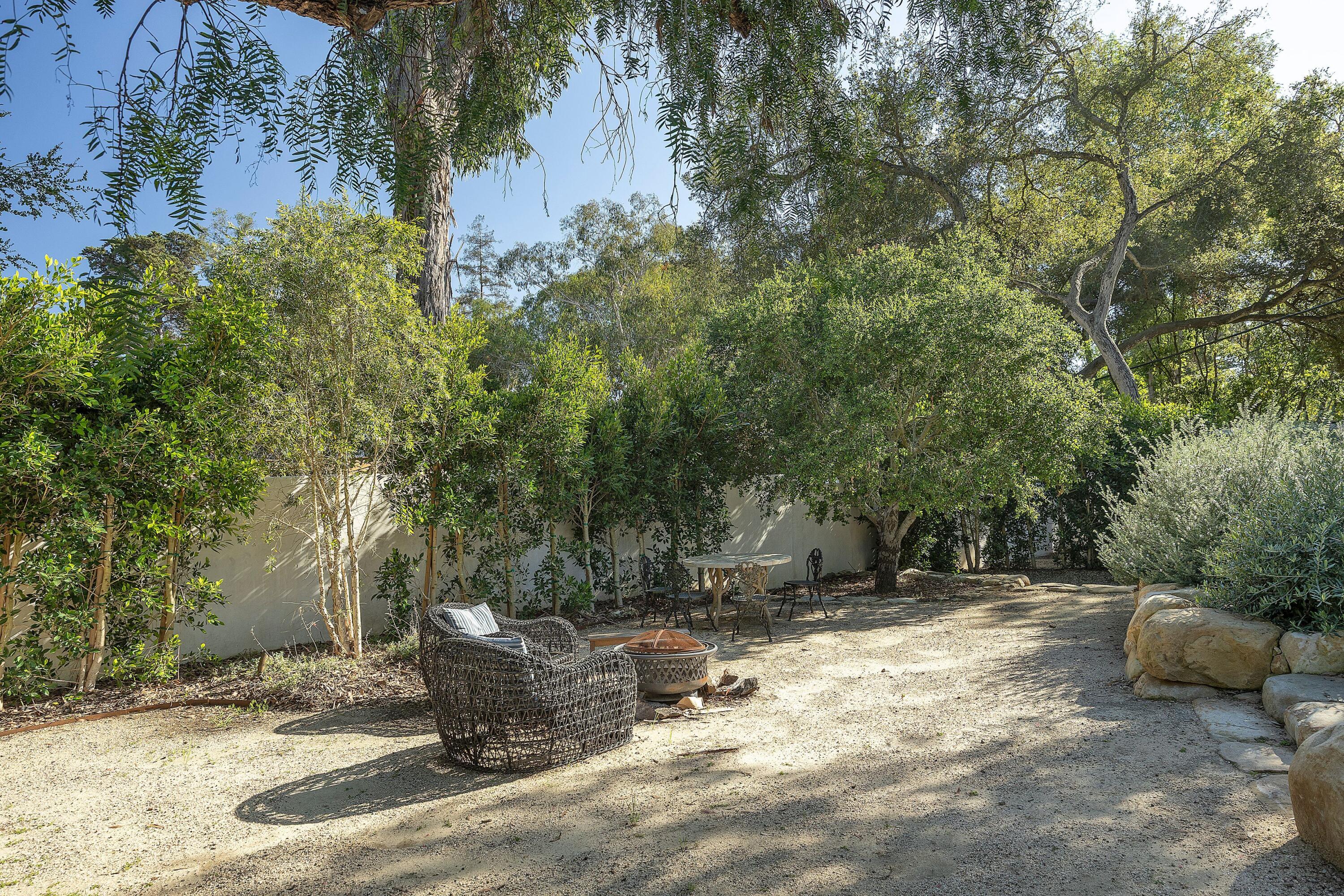487 Hot Springs Road Santa Barbara, CA 93108 - Photo 37 of 47 a backyard of a house with table and chairs