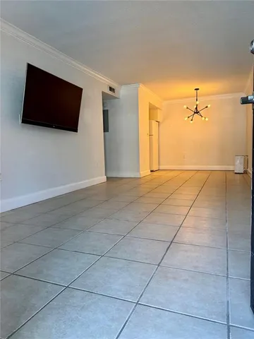 a view of a room with rack and wooden floor