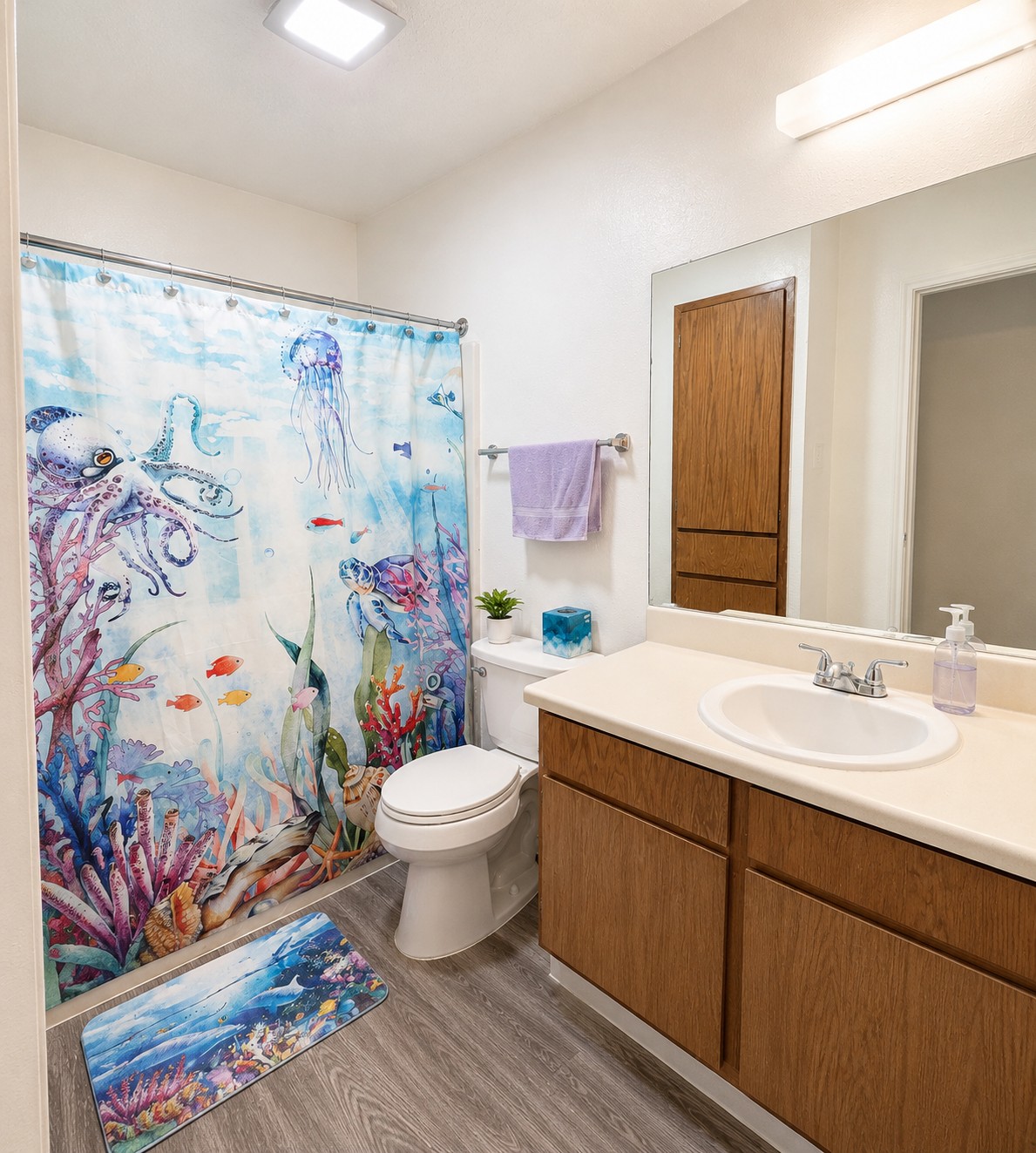 2013 Margalene Way Austin, TX 78728 - Photo 13 of 19 Functional full bathroom featuring practical wood-look cabinetry and resilient vinyl plank flooring.
