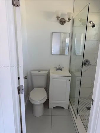 a bathroom with a toilet sink and a shower