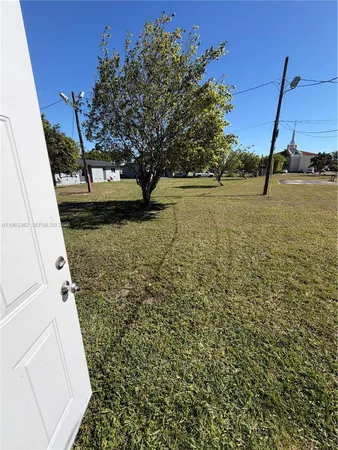 a view of a yard with an trees
