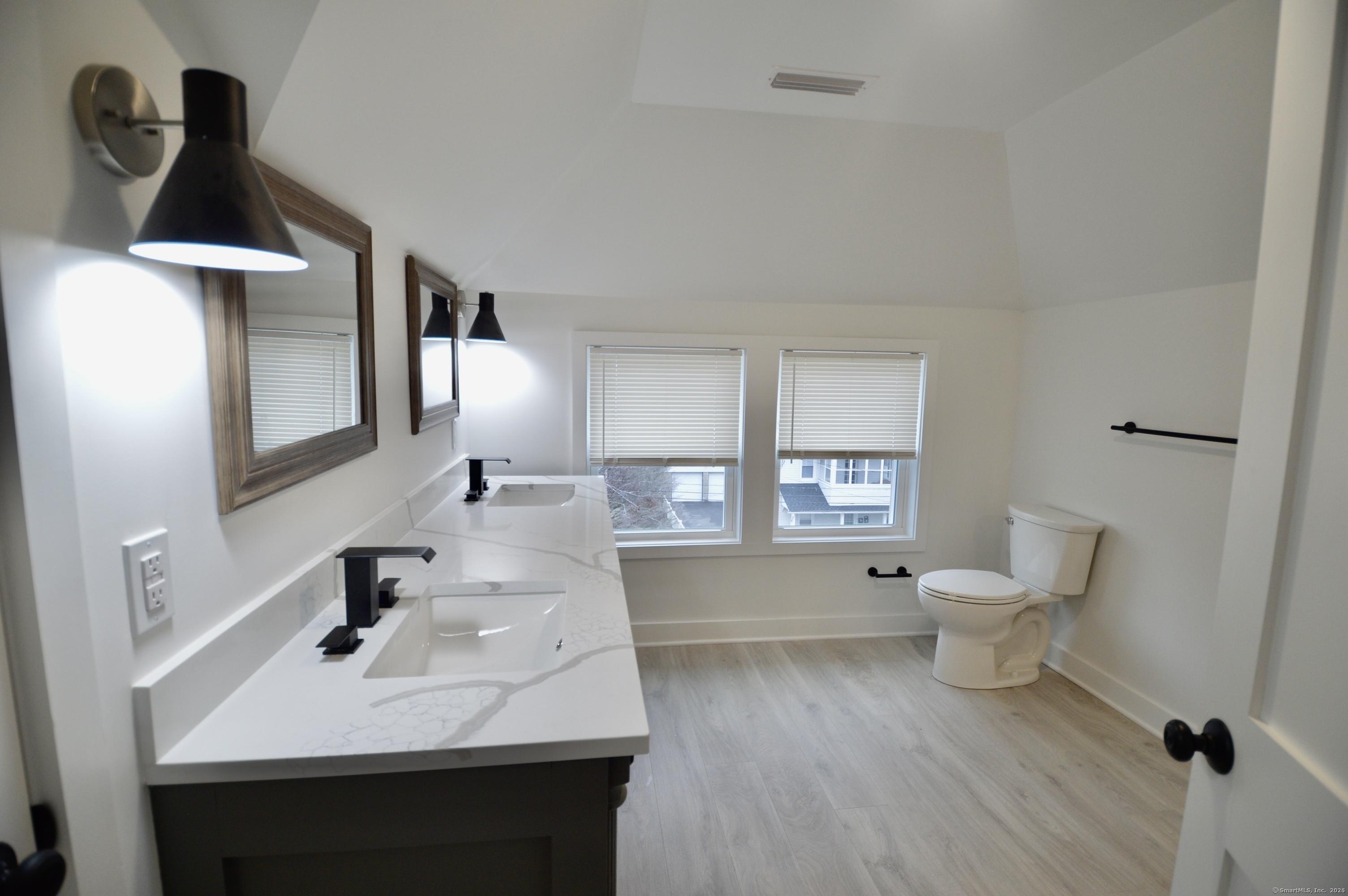 21 Nichols Street Ansonia, CT 06401 - Photo 14 of 21 a bathroom with a sink toilet a mirror and bathtub