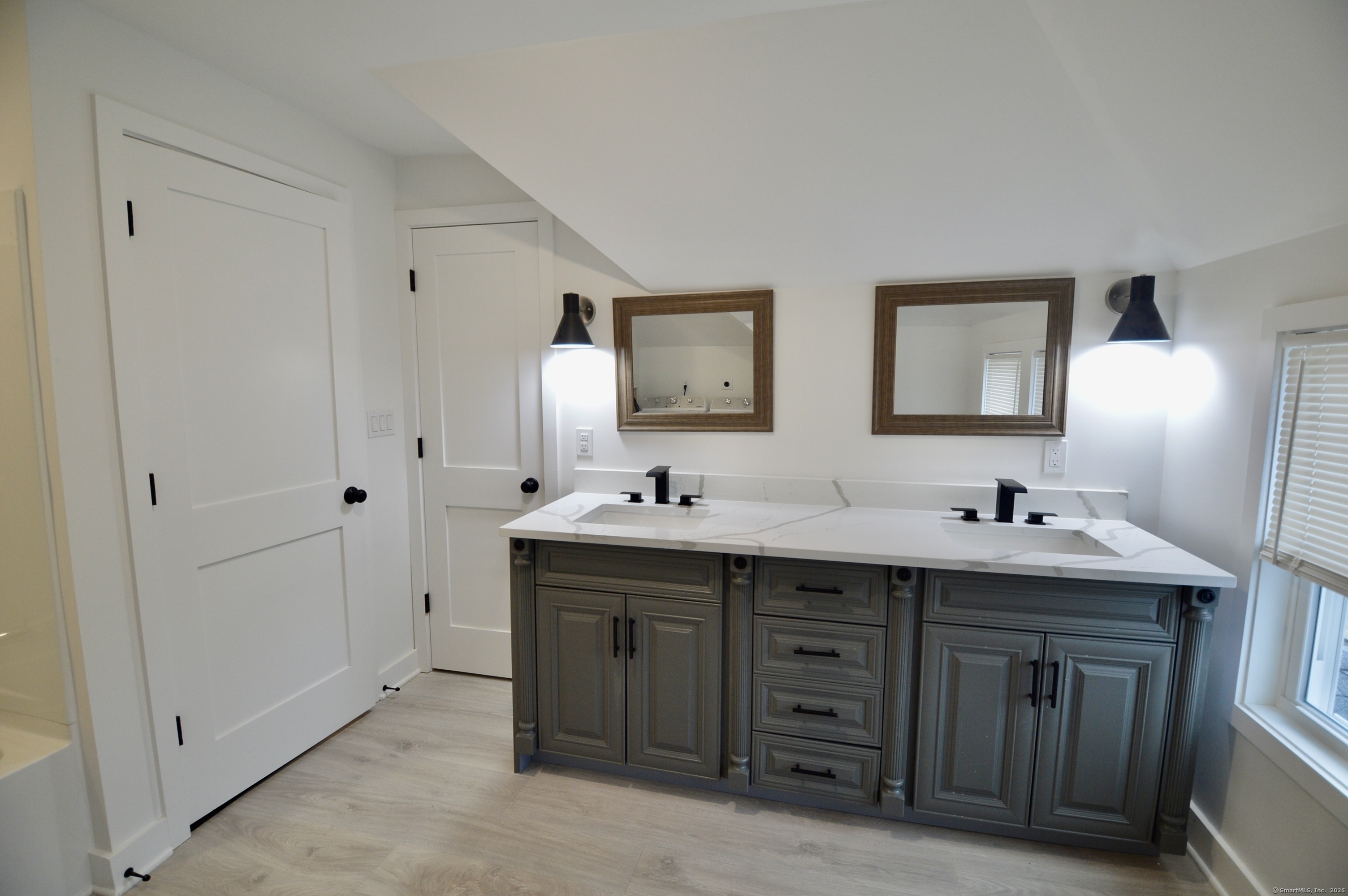 21 Nichols Street Ansonia, CT 06401 - Photo 16 of 21 a bathroom with double sink and mirror