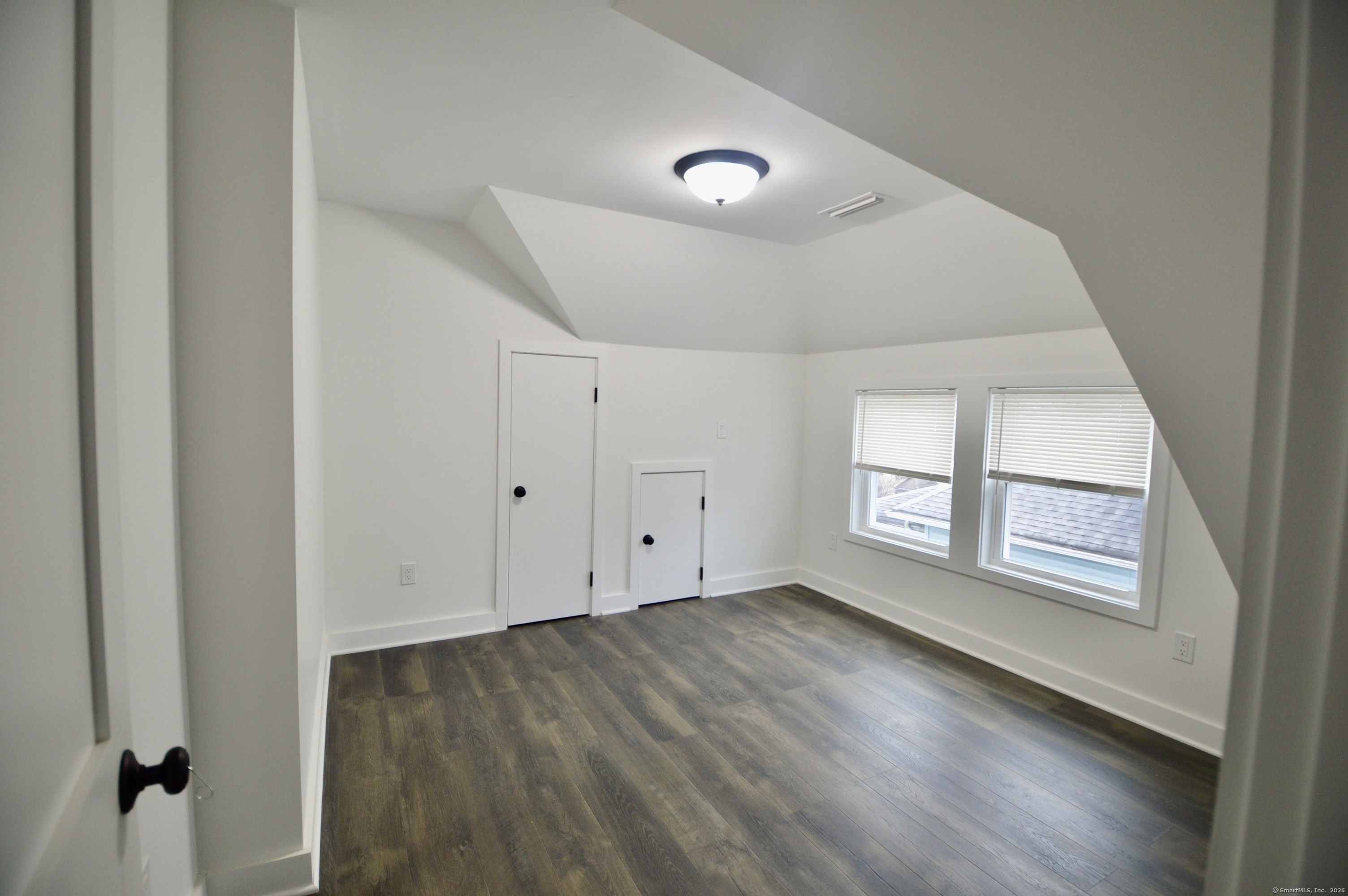 21 Nichols Street Ansonia, CT 06401 - Photo 18 of 21 an empty room with wooden floor and windows
