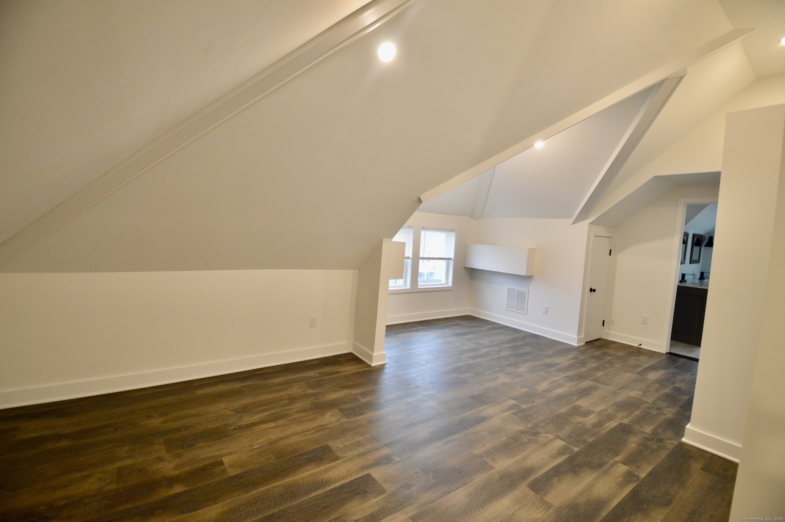 21 Nichols Street Ansonia, CT 06401 - Photo 10 of 21 an empty room with wooden floor and windows