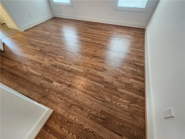 a view of room and wooden floor