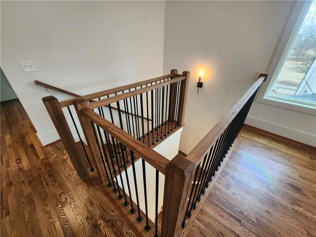 a view of entryway with wooden floor and stairs