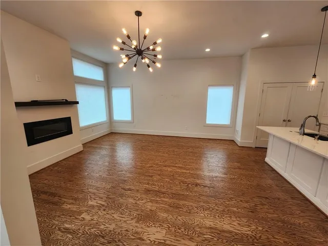 a view of a kitchen with a sink and a stove top oven