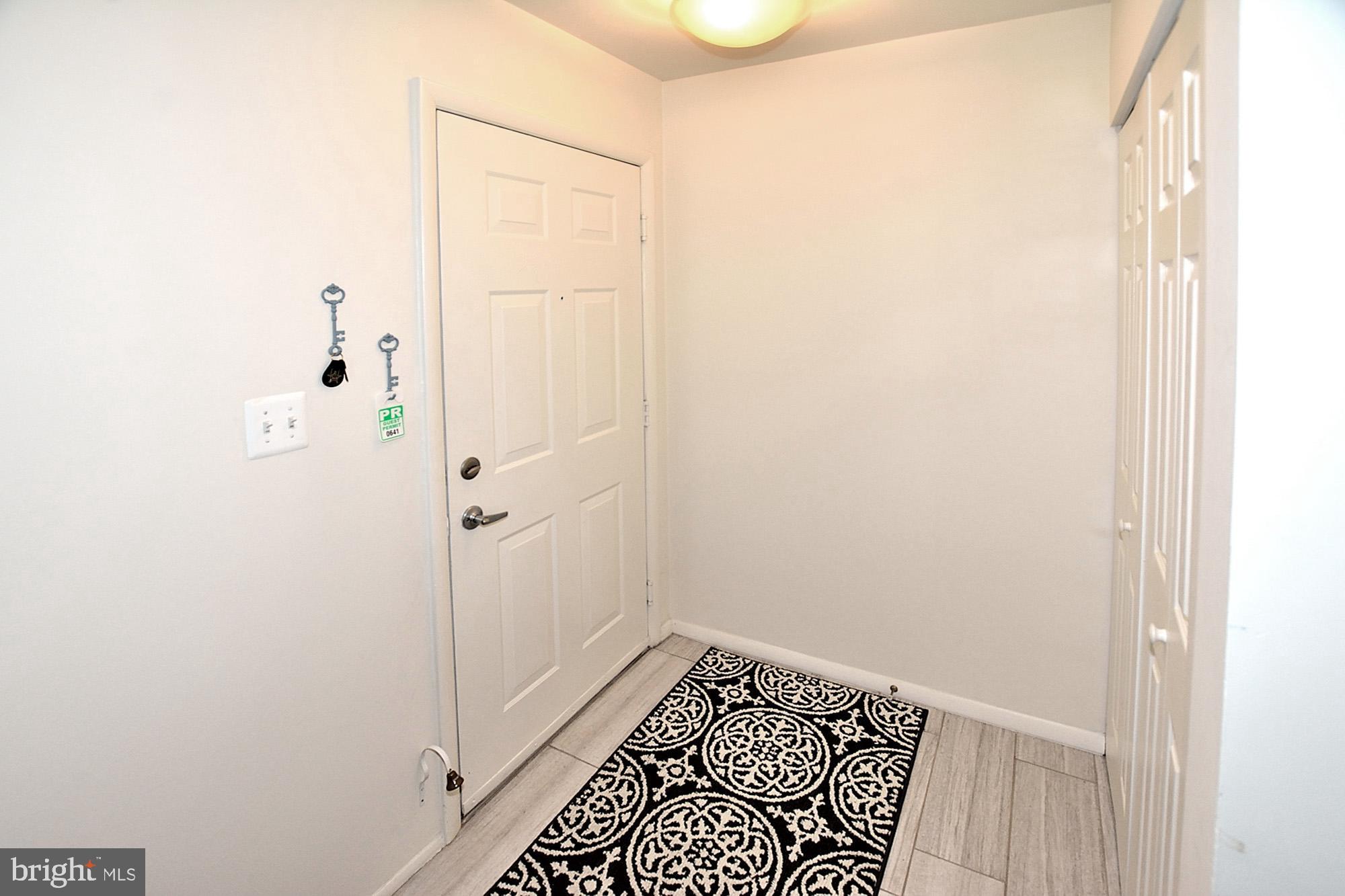 1715 Ascot Way, Unit D Reston, VA 20190 - Photo 2 of 36 Foyer-porcelain tile