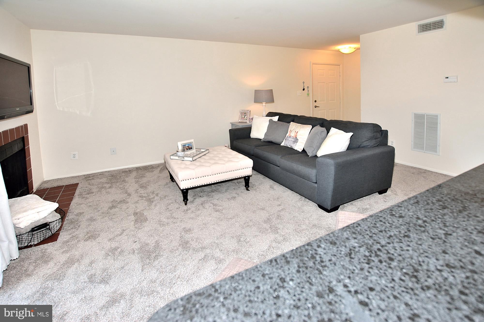 1715 Ascot Way, Unit D Reston, VA 20190 - Photo 4 of 36 Spacious living rm w/fireplace