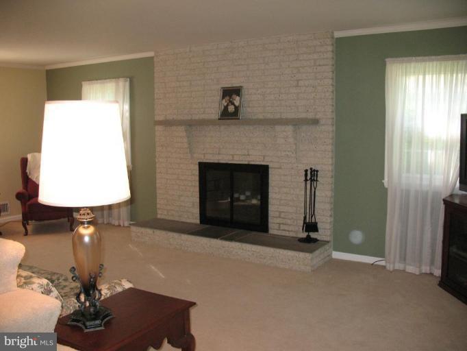 202 Eastern Road Pasadena, MD 21122 - Photo 12 of 28 SPACIOUS LIVING RM W/BRICK WOOD BURNING FIREPLACE