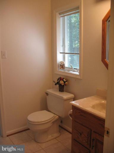 202 Eastern Road Pasadena, MD 21122 - Photo 4 of 28 HALF BATH MAIN LEVEL CERAMIC FLOOR