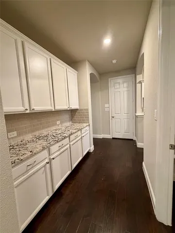 a view of a kitchen with electric appliances
