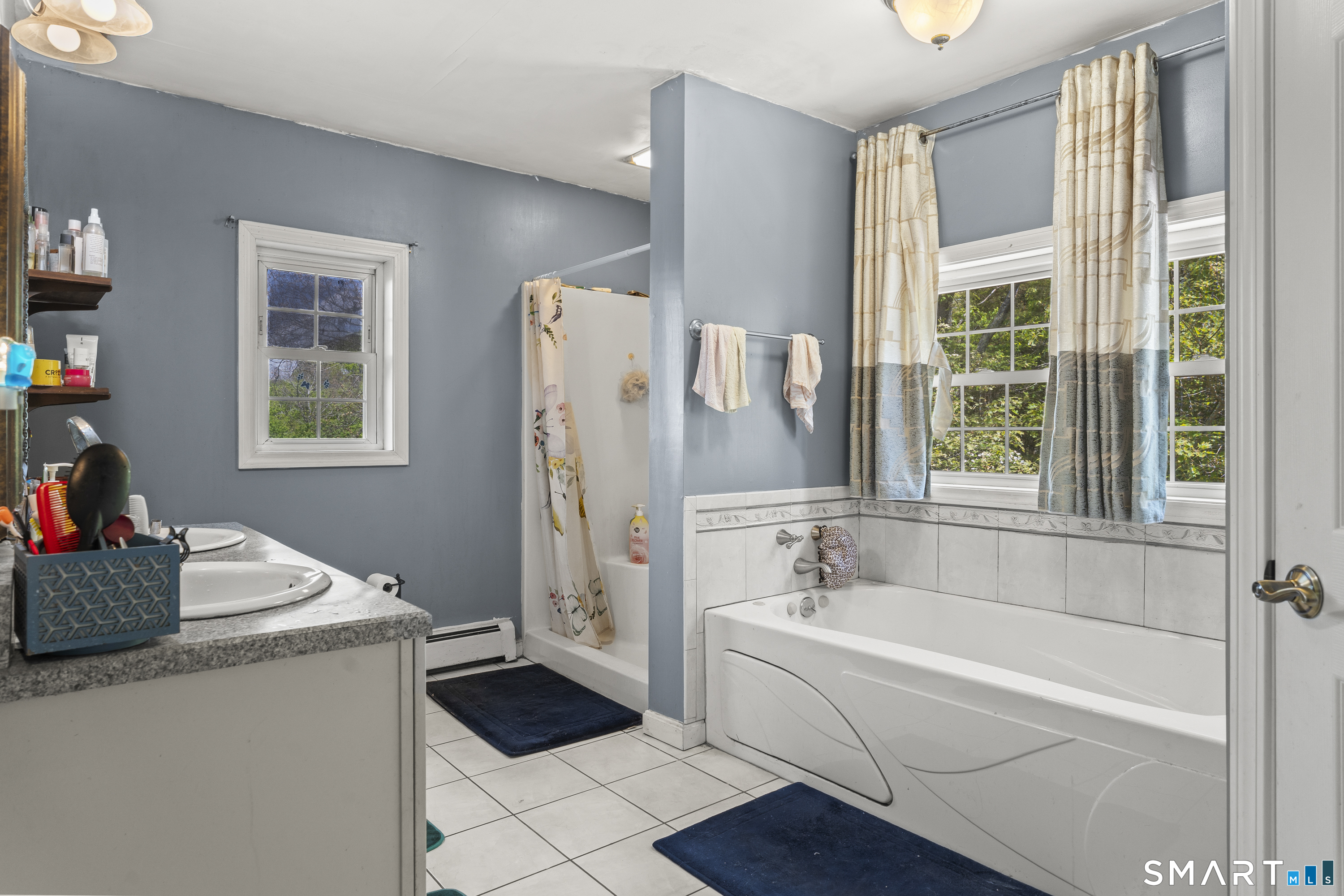 52 Middle Road Preston, CT 06365 - Photo 26 of 39 a bathroom with a tub sink and a window