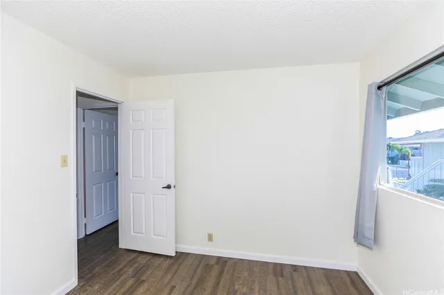 a view of hallway with wooden floor