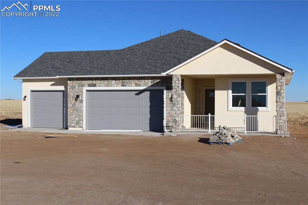 a front view of a house with a garage