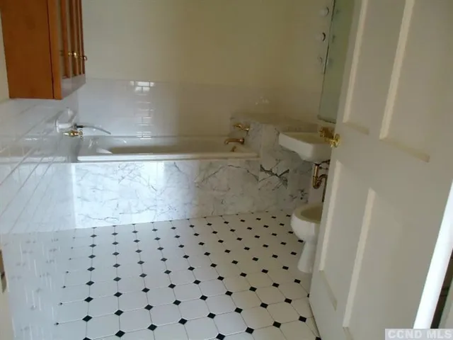 a bathroom with a sink and a shower