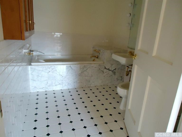 974 Old Post Road Kinderhook, NY 12106 - Photo 8 of 10 a bathroom with a sink and a shower