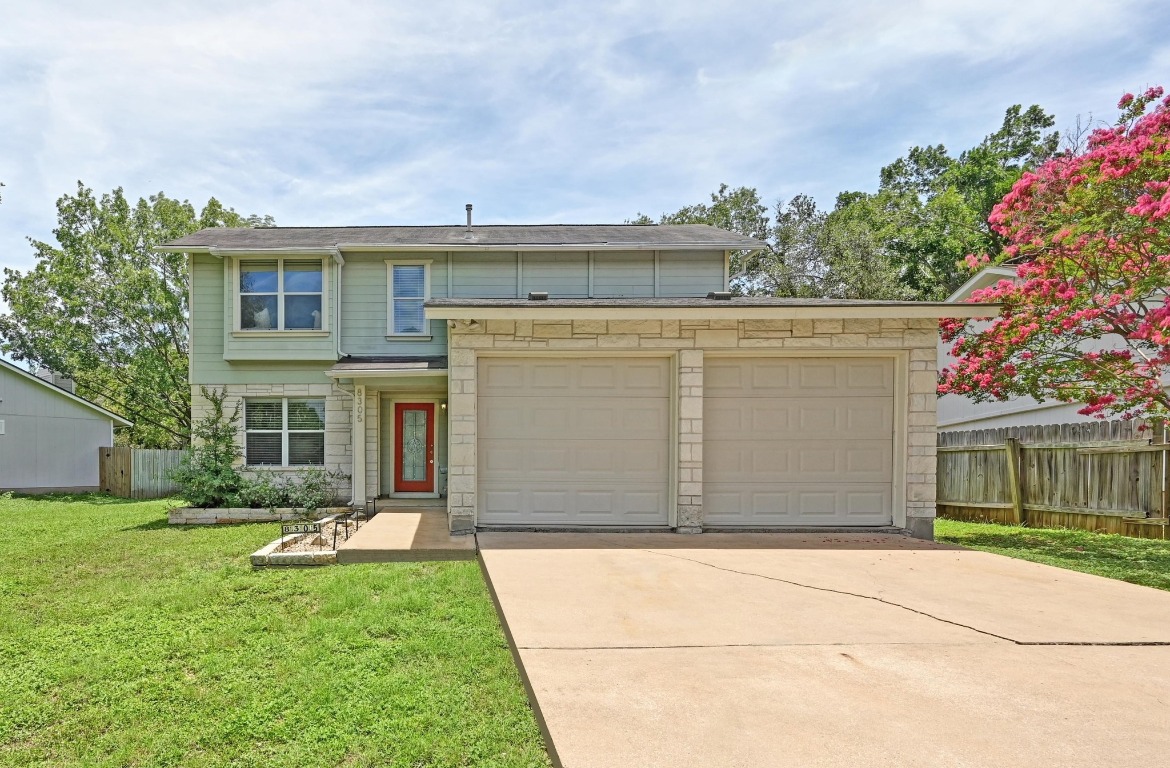 a view of house with yard