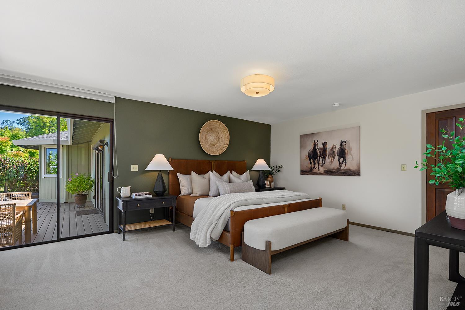 7595 Giusti Road Forestville, CA 95436 - Photo 28 of 41 a spacious bedroom with a bed and a large window