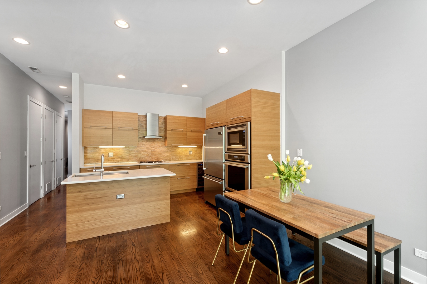 1838 West Rice Street, Unit 2 Chicago, IL 60622 - Photo 6 of 13 a kitchen with a table and chairs in it