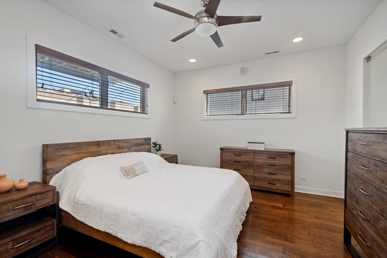 1838 West Rice Street, Unit 2 Chicago, IL 60622 - Photo 8 of 13 a bedroom with a bed and a chandelier