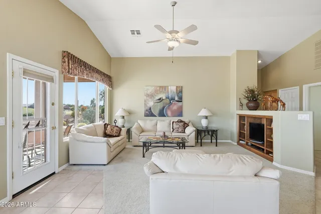 a living room with furniture and a large window