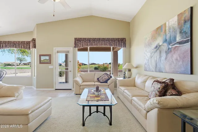 a kitchen with stainless steel appliances granite countertop a refrigerator a stove and a sink