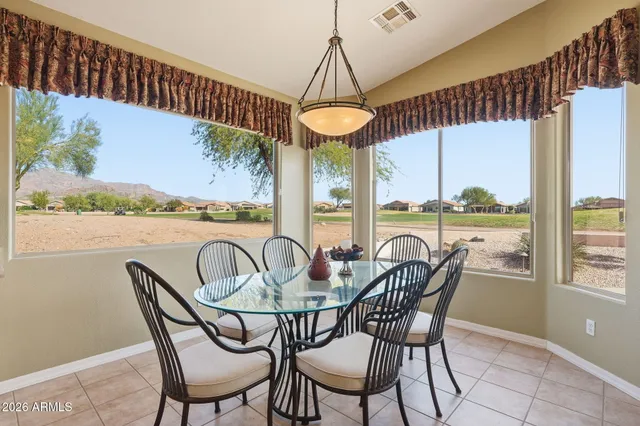 a view of a chairs and table in patio