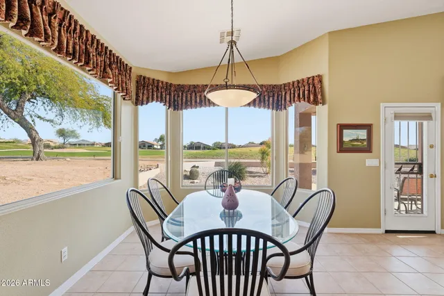 a dining room with furniture and window
