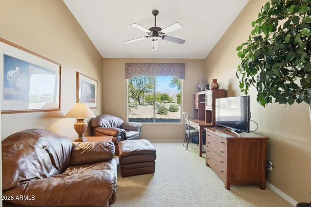a view of a glass door and a yard from a window