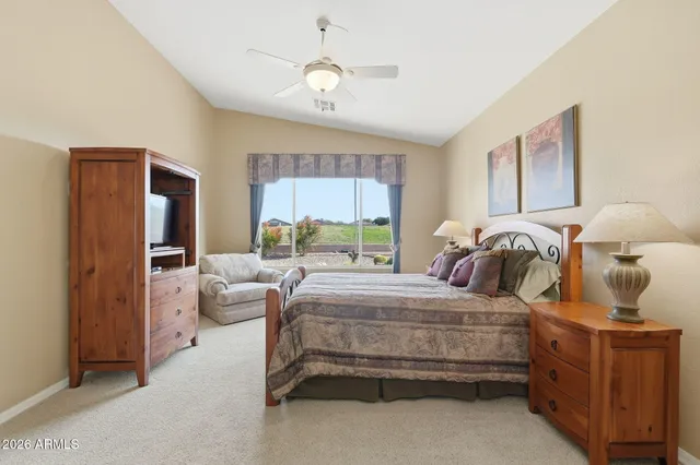 a bedroom with a bed and a couch