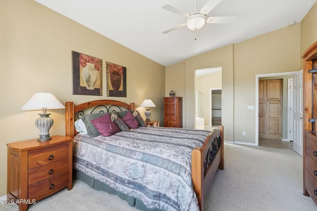 a bathroom with double vanity sinks and a mirror
