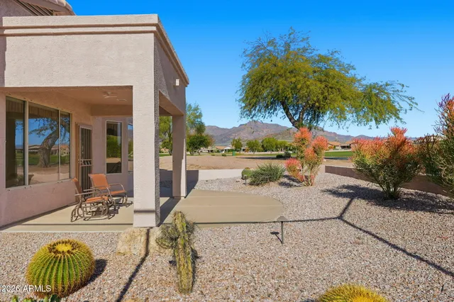 an aerial view of a house with a yard basket ball court and outdoor seating