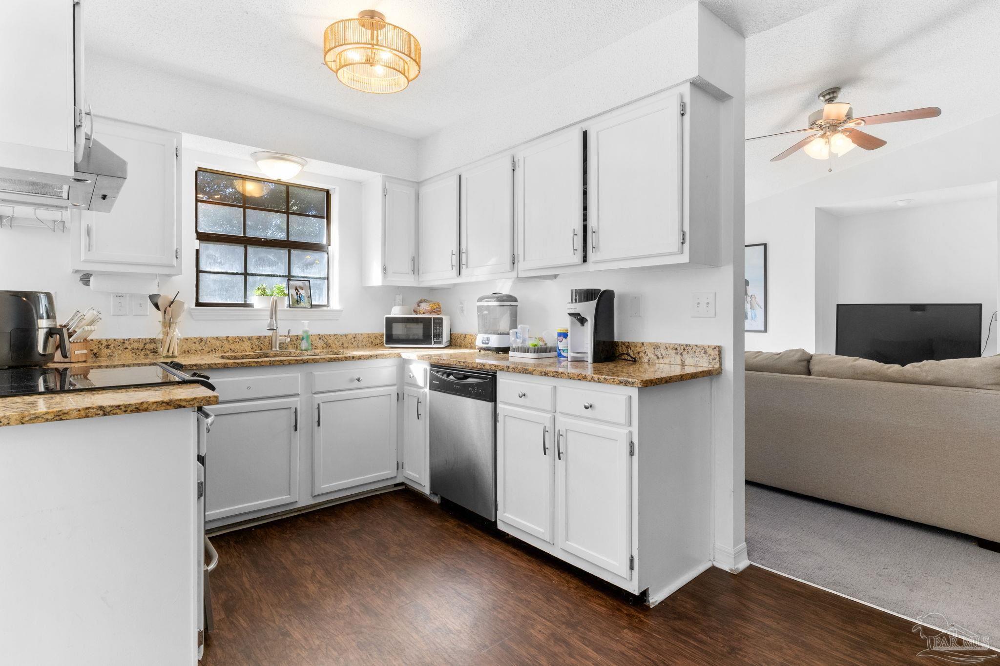 121 Claire Drive Crestview, FL 32536 - Photo 12 of 45 a kitchen with cabinets a sink and appliances