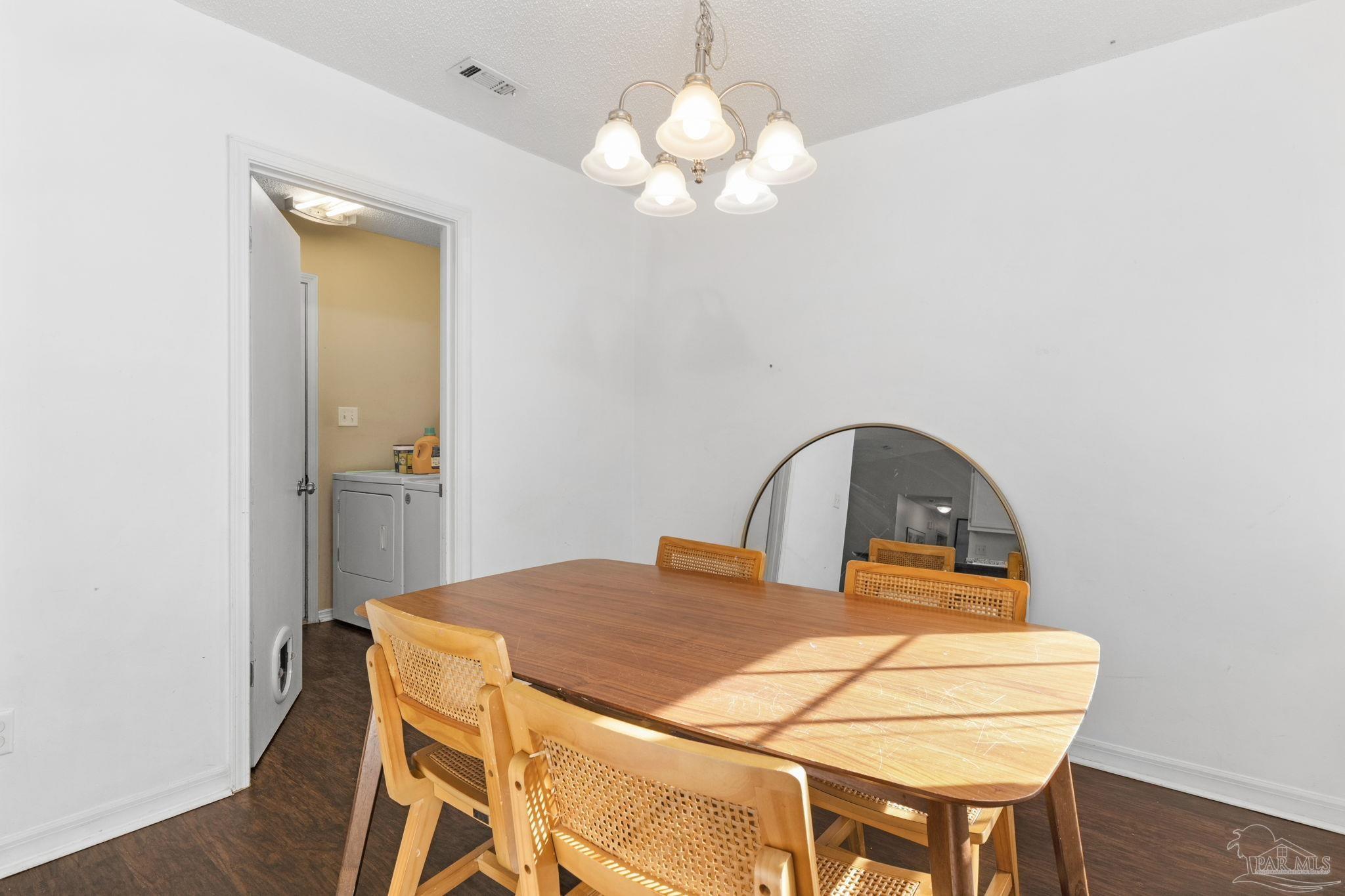 121 Claire Drive Crestview, FL 32536 - Photo 18 of 45 a view of a dining room with a table and chairs