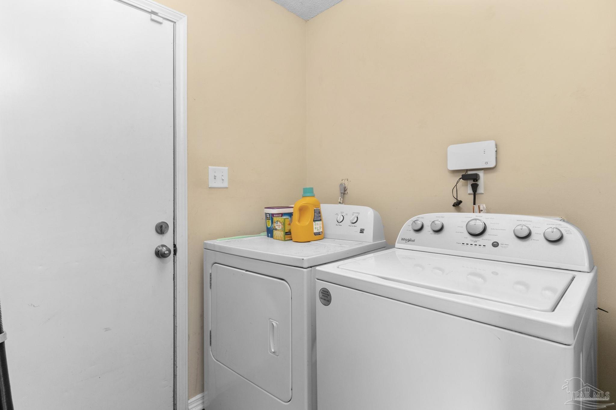 121 Claire Drive Crestview, FL 32536 - Photo 19 of 45 a utility room with dryer and washer