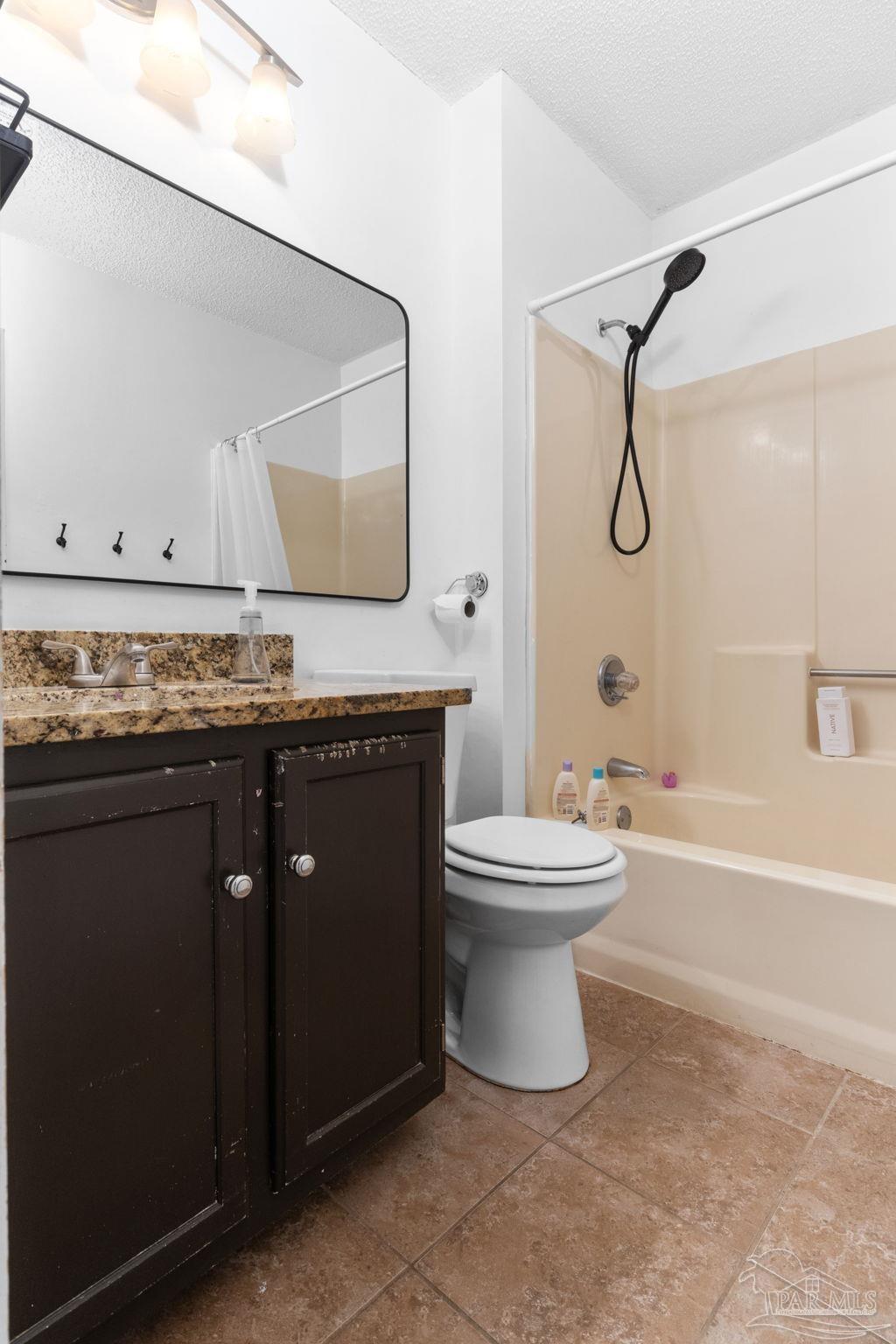 121 Claire Drive Crestview, FL 32536 - Photo 33 of 45 a bathroom with a granite countertop toilet sink and mirror