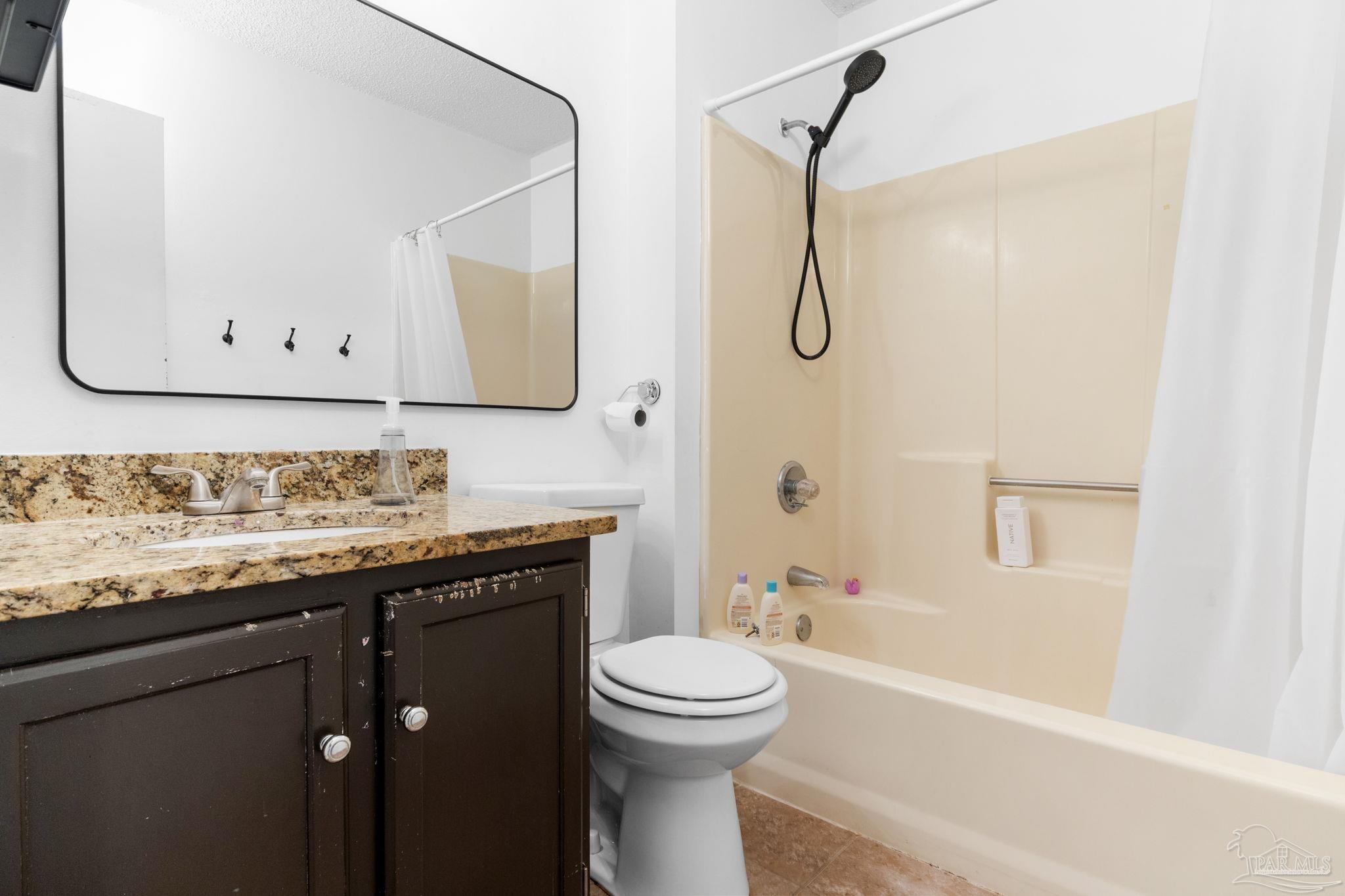 121 Claire Drive Crestview, FL 32536 - Photo 34 of 45 a bathroom with a granite countertop sink toilet and shower