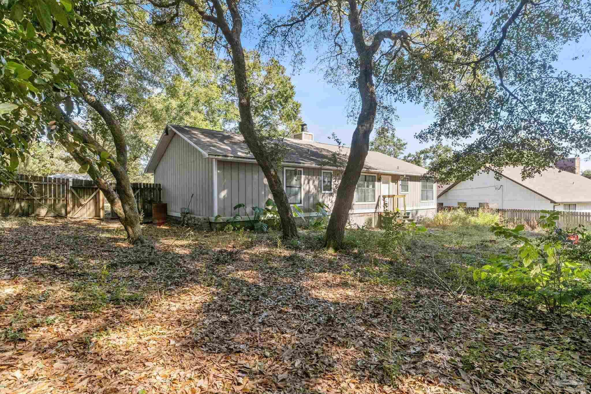 121 Claire Drive Crestview, FL 32536 - Photo 38 of 45 a view of a house with a tree in the yard