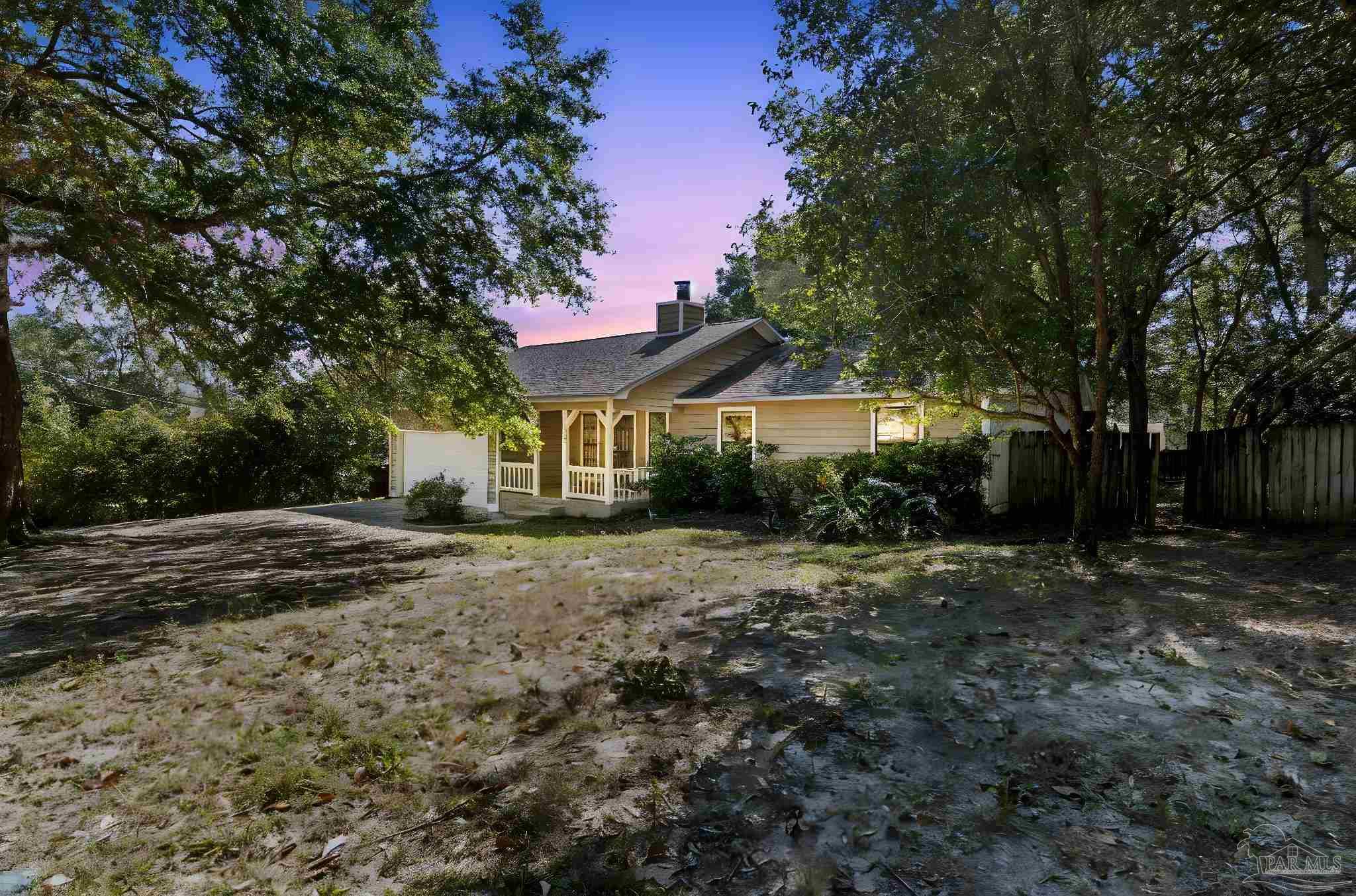 121 Claire Drive Crestview, FL 32536 - Photo 44 of 45 a front view of a house with a yard and tree s