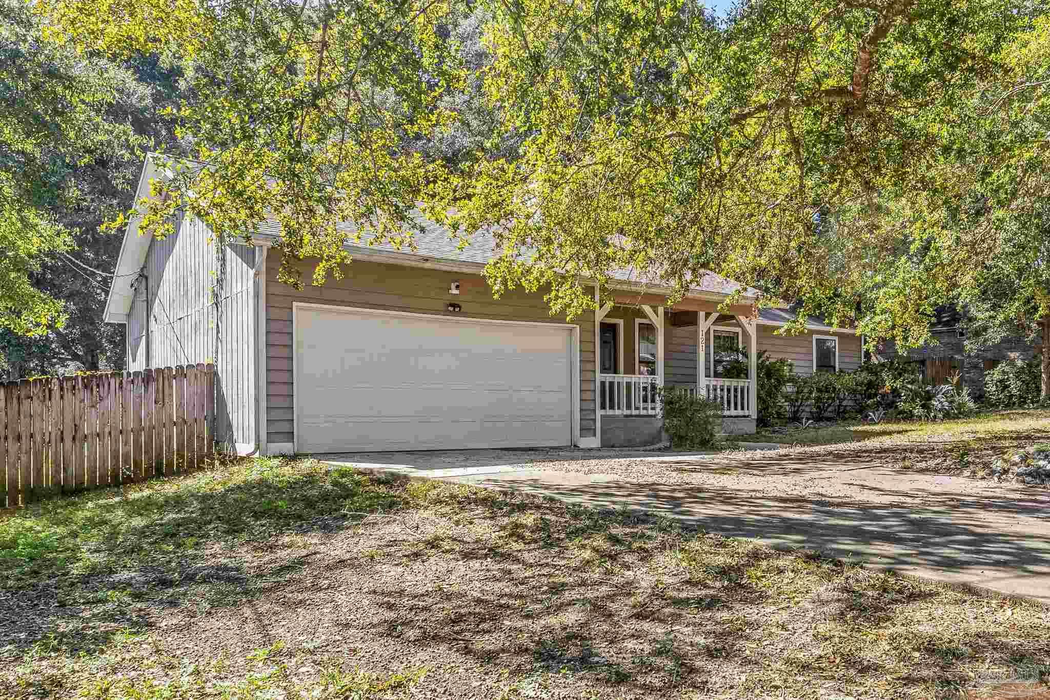121 Claire Drive Crestview, FL 32536 - Photo 45 of 45 a front view of a house with a garden