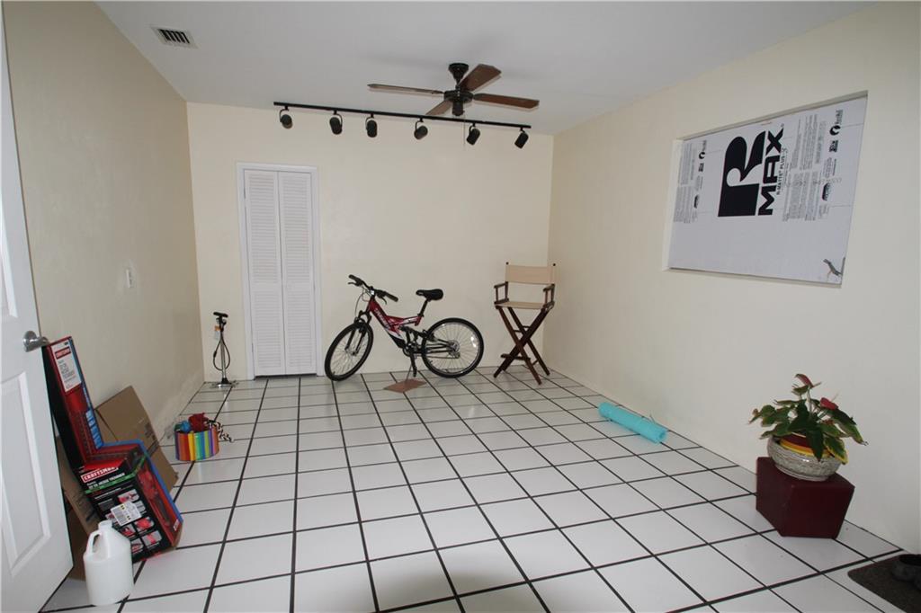 1153 Northwest Spruce Ridge Drive Stuart, FL 34994 - Photo 18 of 22 a view of a workspace with furniture