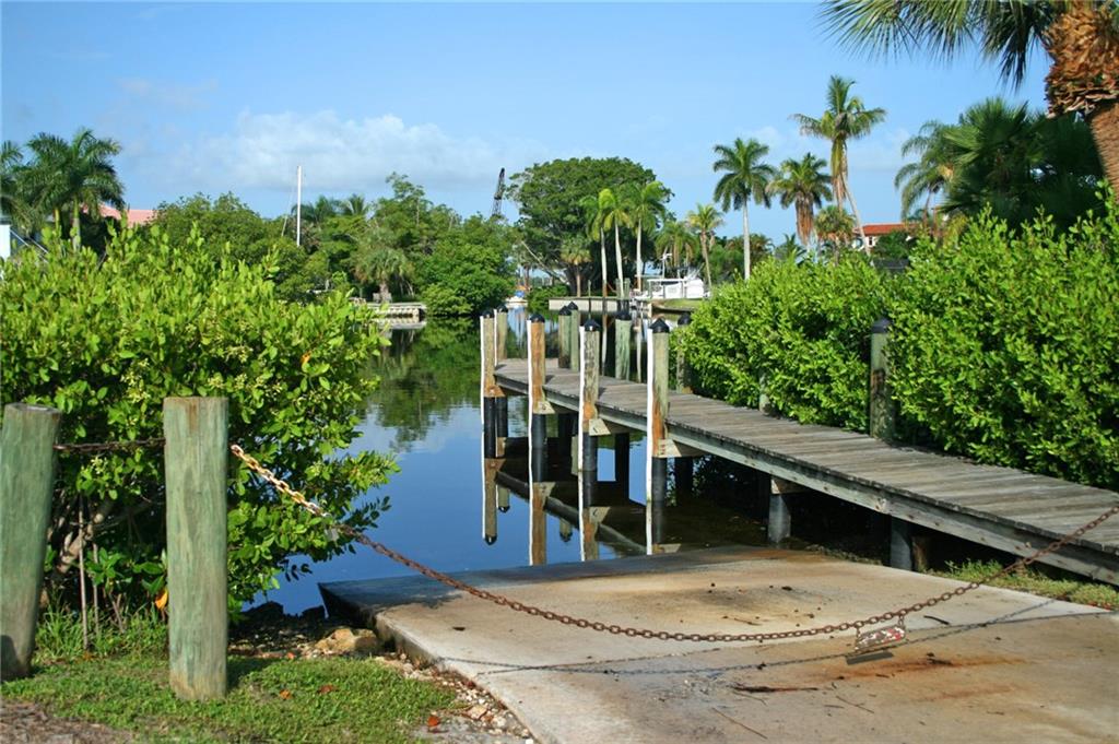1153 Northwest Spruce Ridge Drive Stuart, FL 34994 - Photo 20 of 22 a view of outdoor space yard and swimming pool